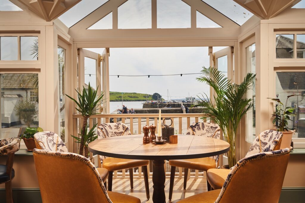 Table with view in The Rising Sun St Mawes Restaurant